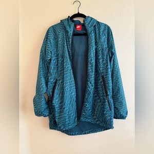 Nike Teal and White Patterned Jacket. Size small.